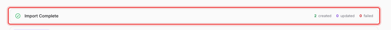 The Import Complete summary showing 2 created, 0 updated, and 0 failed